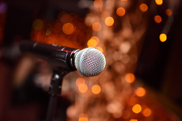 Fototapeta na wymiar microphone close-up on the background of a nightclub or karaoke