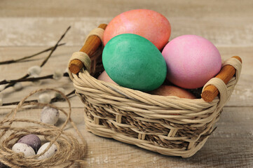painted easter eggs in a wicker basket