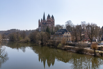 Fototapeta na wymiar Limburg Cathedral with reflection in the river Lahn