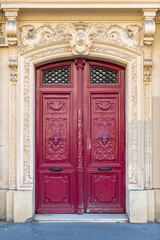 Paris, an old wooden door, typical building in the center
