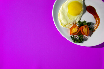 Scrambled eggs with tomatoes. Morning breakfast with fried eggs, vegetables and green onions. Background with food.