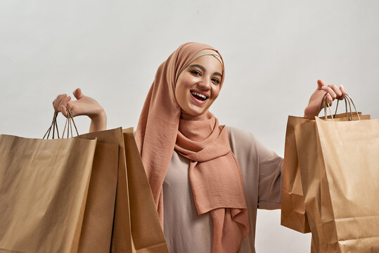 Smiling Young Arab Girl In Traditional Hijab After Shopping