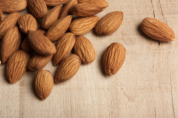 Closeup of almond nuts on wooden table