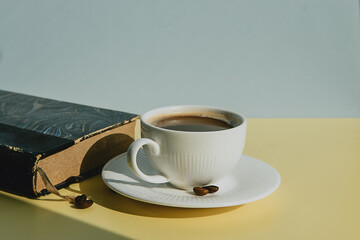 breakfast with a cup of black coffee on a colored background 