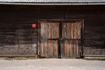close-up of a wooden building with a large door