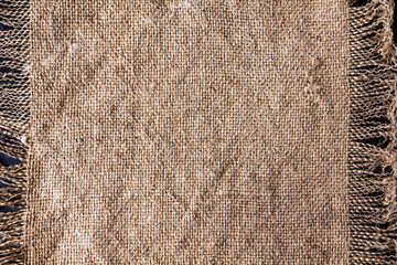 Rough canvas sackcloth with fringe.