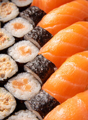 Sushi, beautiful sushi arrangement in detail, black background, selective focus.