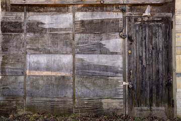 old wooden barn facade with a door