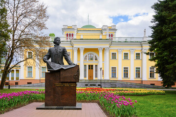Monument to Nikolai Rumyantsev in Gomel. Gomel palace and park ensemble. Belarus. Blooming tulips...