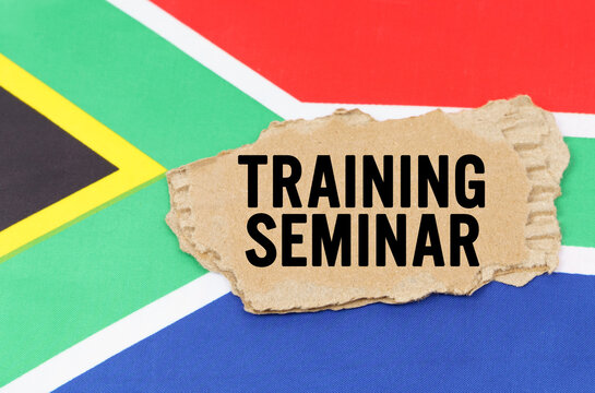 On the flag of South Africa lies a cardboard box with the inscription- TRAINING SEMINAR