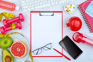 shaped plate, water, fruits, yoga mat, smartphone  and sports fitness accessories