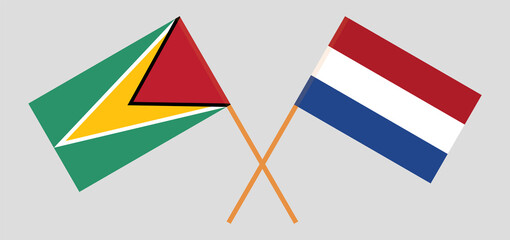 Crossed flags of Guyana and the Netherlands. Official colors. Correct proportion