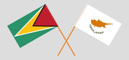 Crossed flags of Guyana and Cyprus. Official colors. Correct proportion