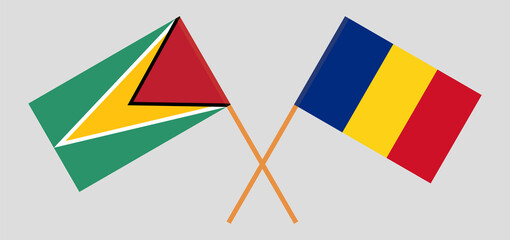 Crossed flags of Guyana and Romania. Official colors. Correct proportion