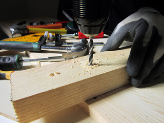   drilling wood with a drill   