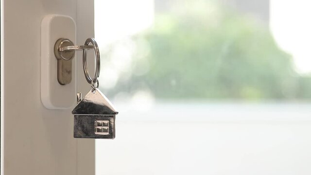 keys with house key ring on the door