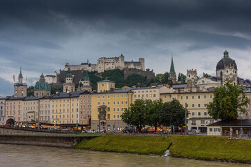 Fototapeta premium SALZBURG, AUSTRIA, 2 AUGUST 2020: Beautiful landscape of the Salzburg Castle and the Salzach River