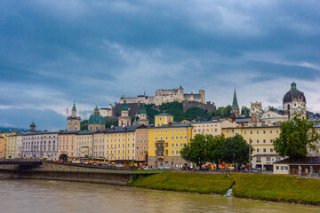 Fototapeta premium SALZBURG, AUSTRIA, 2 AUGUST 2020: Beautiful landscape of the Salzburg Castle and the Salzach River