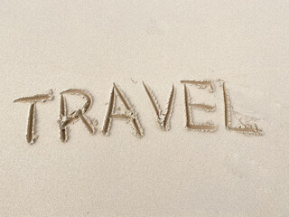 Travel inscription on summer sandy beach. Vacation and adventure concept