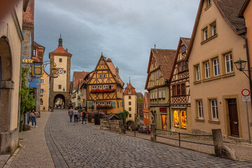ROTHENBURG OB DER TAUBER, GERMANY, 26 JULY 2020 Colorful half-timbered houses in the street of the historic center