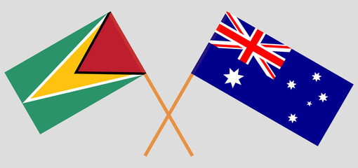 Crossed flags of Guyana and Australia. Official colors. Correct proportion
