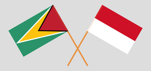 Crossed flags of Guyana and Indonesia. Official colors. Correct proportion