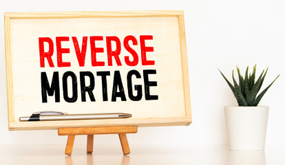 Reverse mortgage form on a table and money.