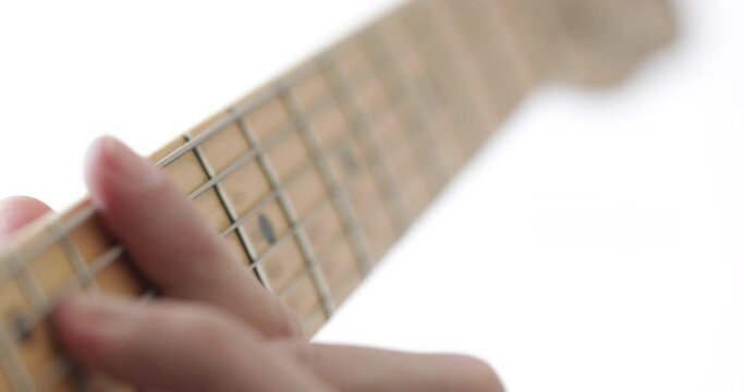 Musician plays tele - type electric guitar, close-up, real people