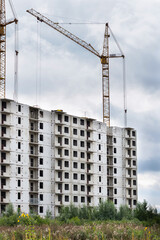 Construction of buildings. Multi-storey residential construction. Concrete frame of the house. Residential complex in nature
