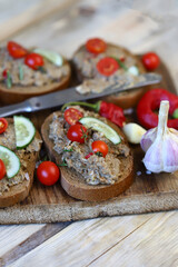Sandwiches with pate on a wooden board. The keto diet.
