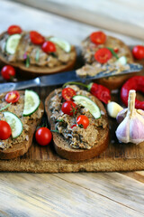 Sandwiches with pate on a wooden board. The keto diet.