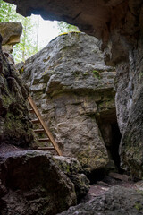 A wooden ladder leads down into the crevices in the Hole in the Wall area of Limehouse Conservation Area in Georgetown, ontario.