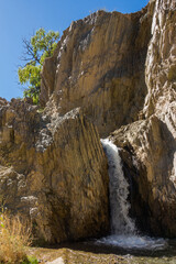 Fototapeta na wymiar A small waterfall called Cascada el Rincon located in El Leoncito National Park in San Juan Province, Argentina.