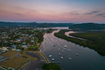 Sunrise waterscape with scattered clouds