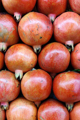 Fresh pomegranate in the market. Close up stock photo.