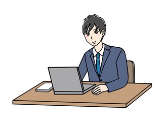 スーツ姿のノートパソコンに向かう男性　斜め