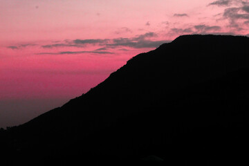 SUNSET IN THE MOUNTAINS.