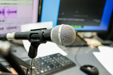 Microphone on the background of a computer monitor. Home recording Studio. 