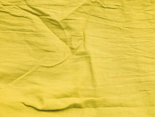 Background texture of fabric cotton linen yellow color. Copy space for your text and design. Textile concept and soft backdrop, Flat lay.