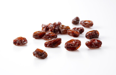 Raisins placed on a white background.