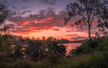 Beautiful Panoramic Riverside Sunset with Dramatic Sky and Reflections