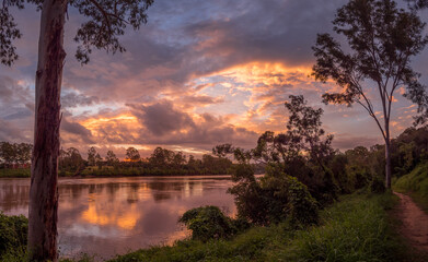 Beautiful Panoramic Riverside Sunset with Dramatic Sky and Reflections