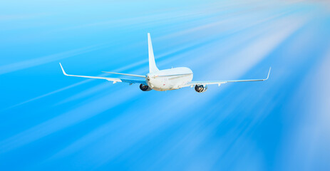 White passenger airplane over the clouds  - Travel by air transport