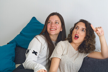 two surprised but happy young friends