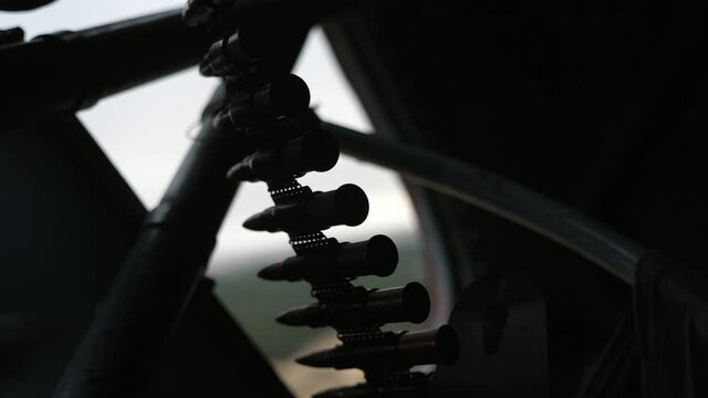 Air machine gun with a trembling cartridge tape and bullets installed in a chopper 