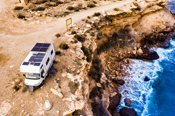 Camper on coast in Spain. Aerial view - obrazy, fototapety, plakaty