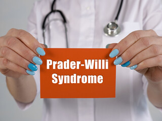 Medical concept meaning Prader-Willi Syndrome with phrase on the piece of paper.