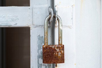 Old Padlock with rust isolated.,Locked Padlock at the metal door.
