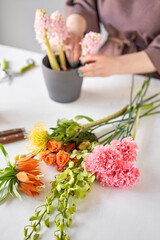 Step by step installation of flowers in a vase. Flowers bunch, set for home. Fresh cut flowers for decoration home. European floral shop. Delivery fresh cut flower.