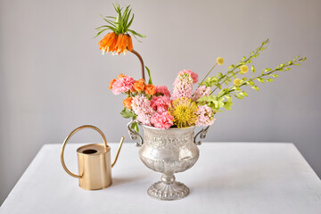 Finished flower arrangement in a vase for home. Flowers bunch, set for interior. Fresh cut flowers for decoration home. European floral shop. Delivery fresh cut flower.